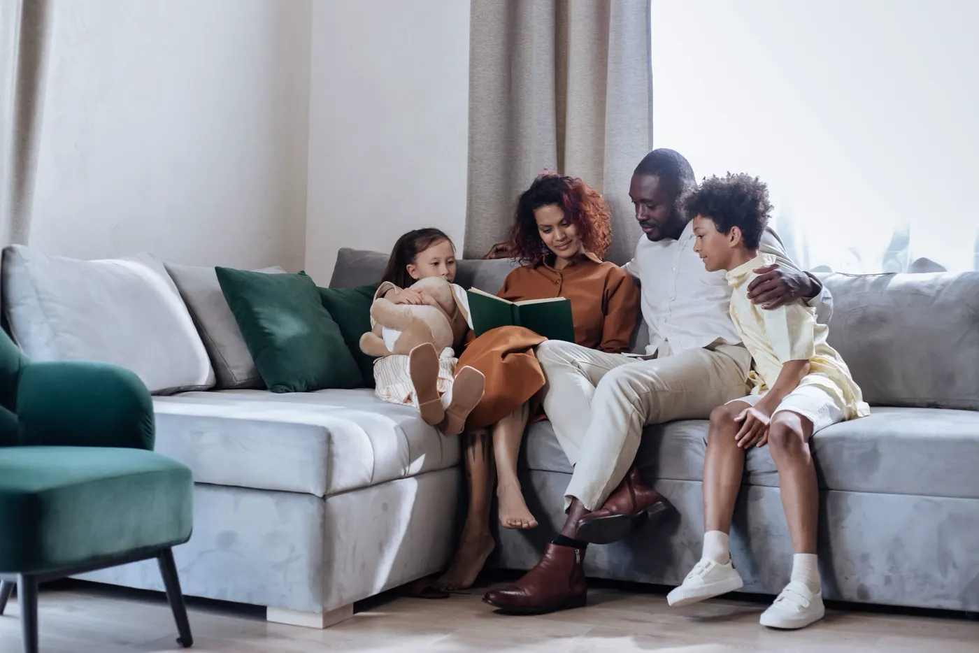 A parent reading with their child at home