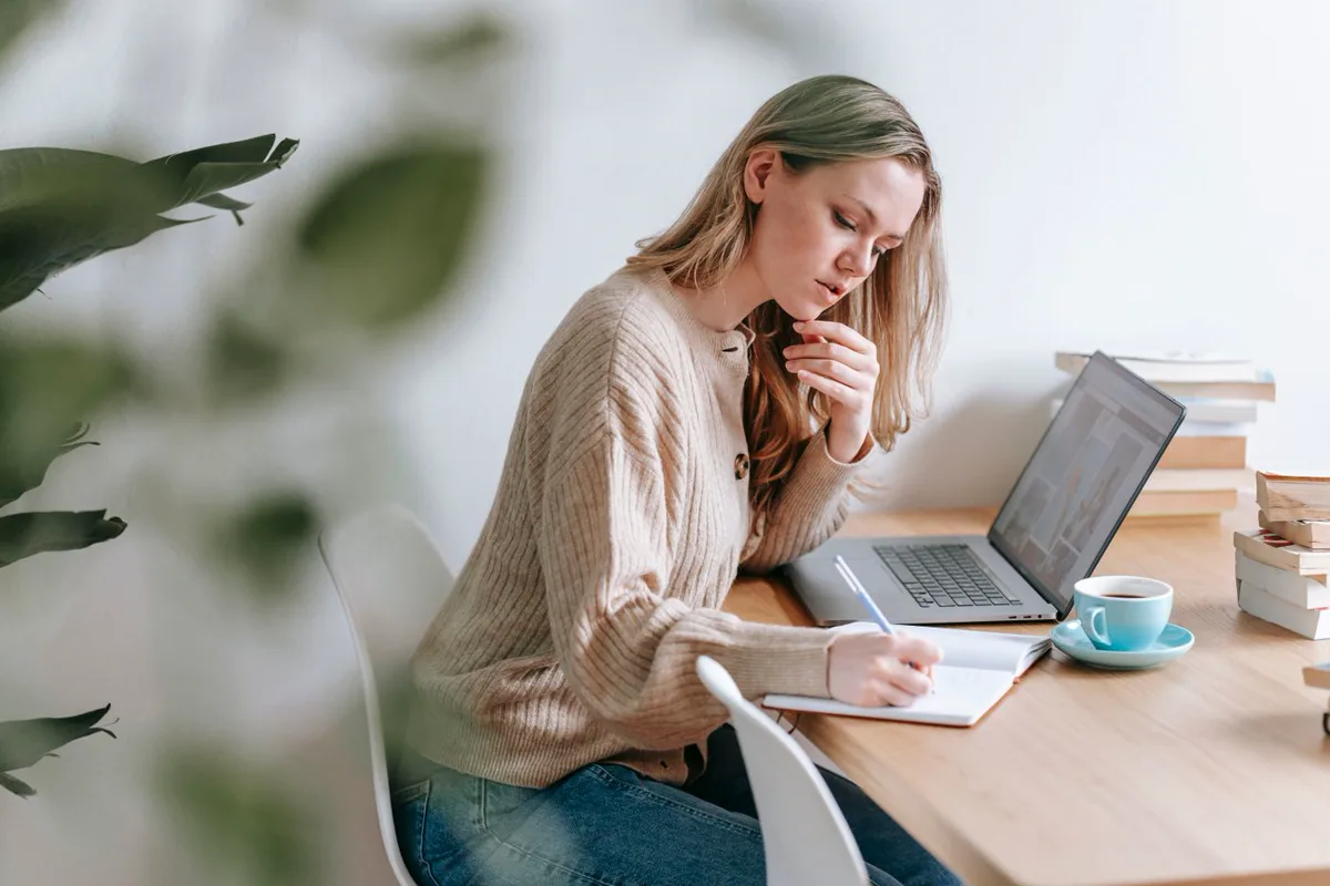 A person reading and replying to messages at a desk