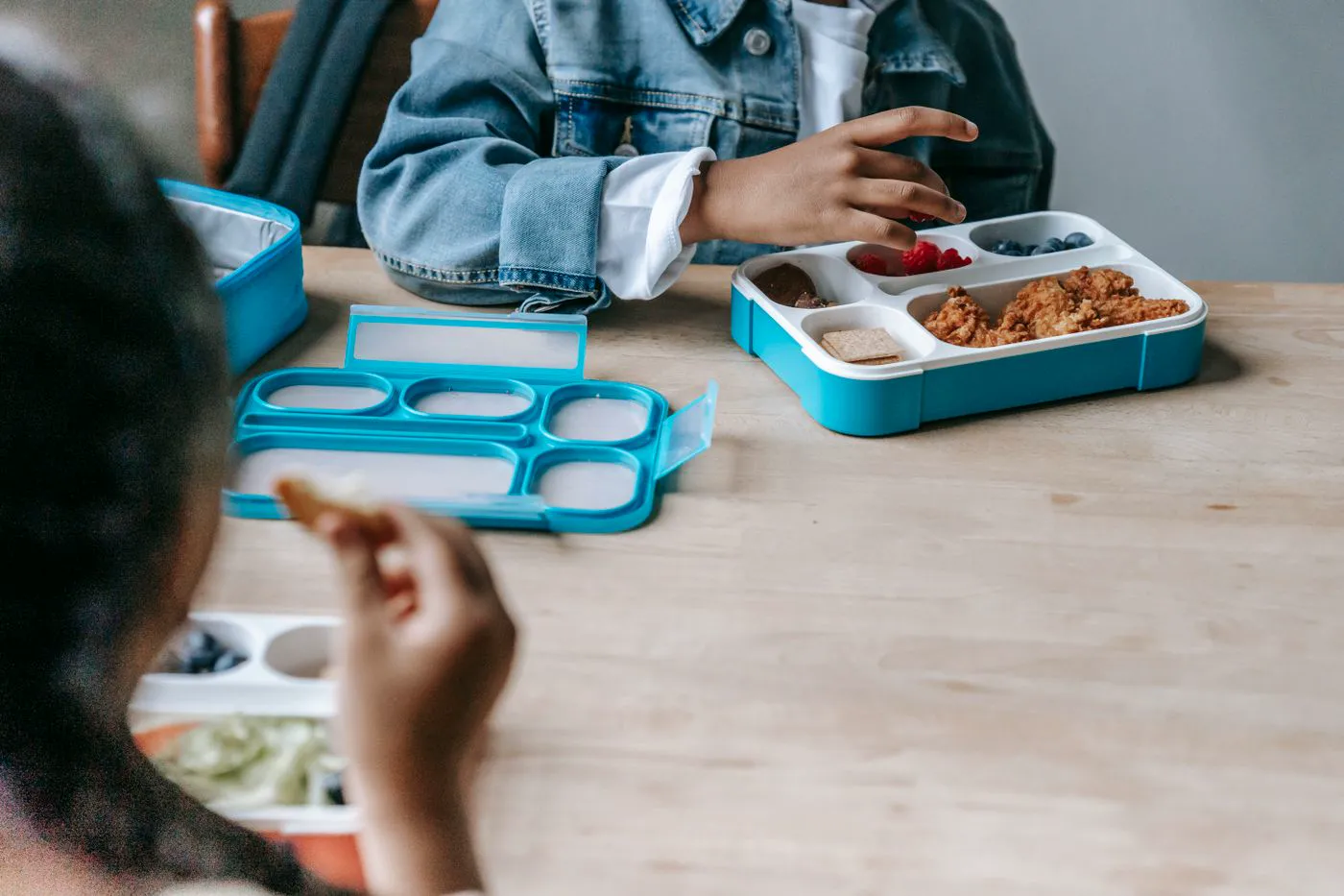 Children eating lunch together at school